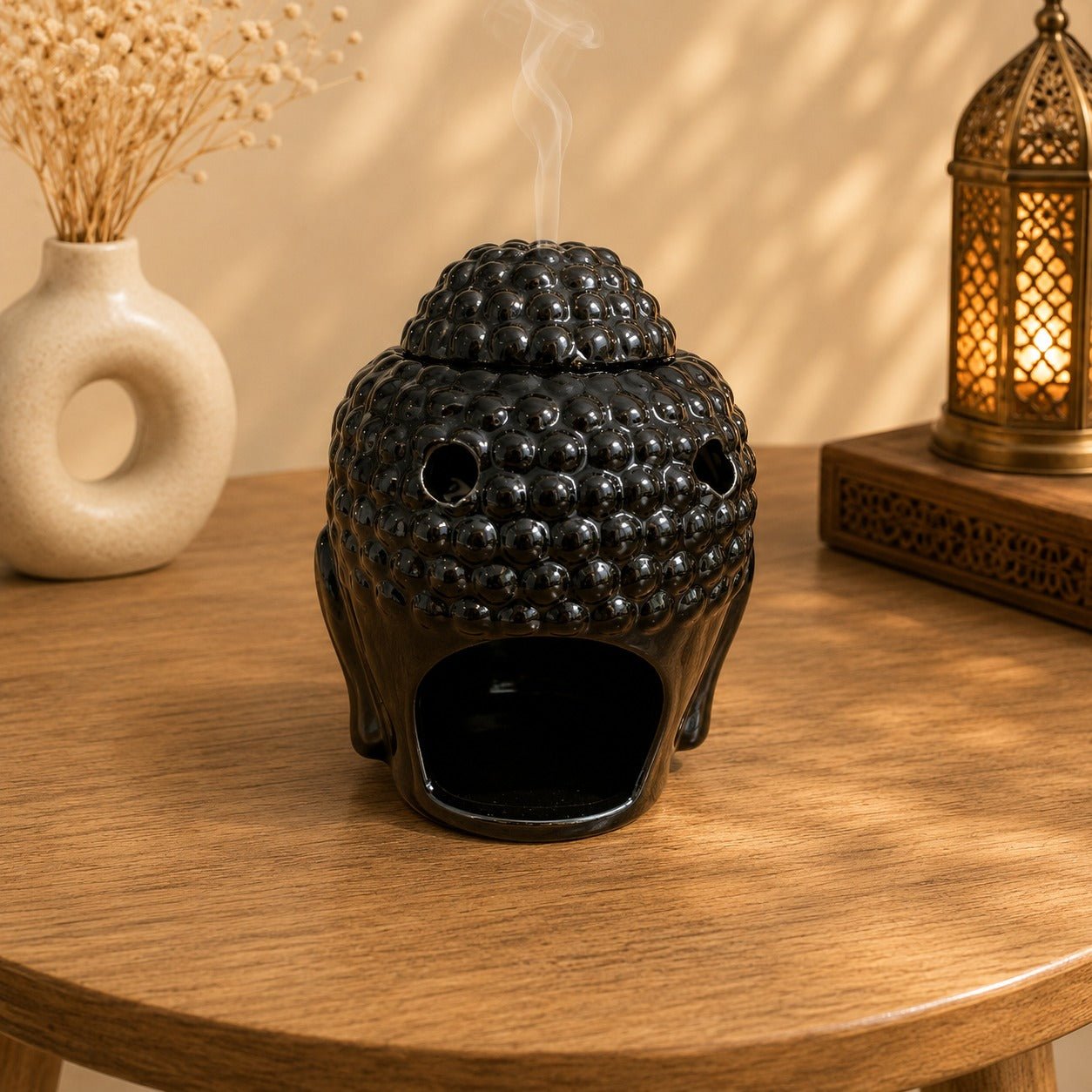 Quemador de Aceites Esenciales Cabeza de Buda Negro - BOUTIQUEDELAINDIA